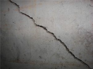 Concrete wall with a diagonal crack